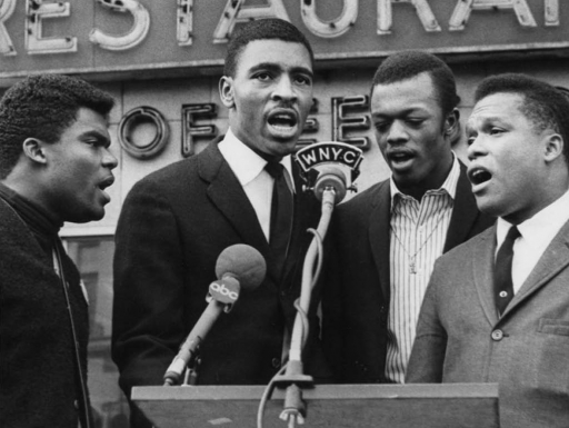 Image: The SNCC Freedom Singers performing in Harlem, 1965. Text: Grades 9–12