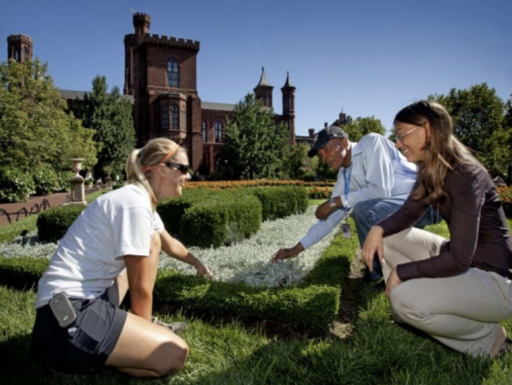 An intern is instructed about gardening techniques. 