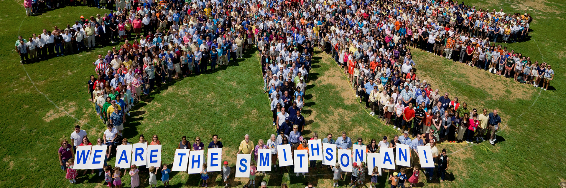 Smithsonian staff pose for picture as the sunburst.